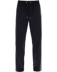 Moncler - Pantalones deportivos de con rayas laterales - Lyst