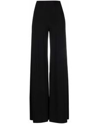 pantalones de vestir y chinos Mujer Ropa de Pantalones Mono Alligator de manga larga Norma Kamali de Tejido sintético de color Negro 