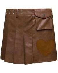 ANDERSSON BELL - 'arina' Brown Pleated Mini Skirt With Heart And Patch Pocket Detail In Faux Leather Woman - Lyst