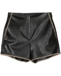 Nanushka - Elza Faux Leather Shorts With Rafia Trim - Lyst