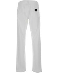Dolce & Gabbana - White Slim Jeans With Logo Plaque In Stretch Cotton Denim Man - Lyst