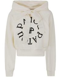 Patou - Cropped Medallion Logo Hoodie Clothing - Lyst