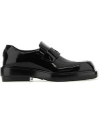 Prada - Triangle-Patch Leather Loafers - Lyst