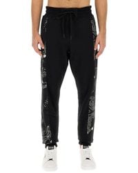 Versace - Chain Couture Jogging Pants - Lyst