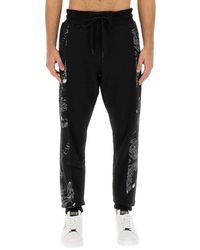 Versace - Chain Couture Jogging Pants - Lyst