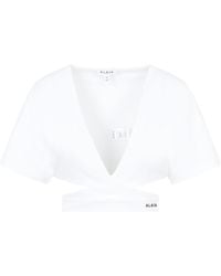 Alaïa - Cropped Top With Crossover Straps - Lyst