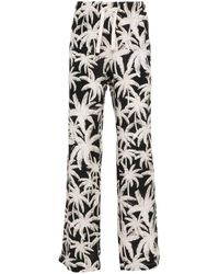 Palm Angels - Allover Logo Loose Fit Trousers - Lyst