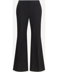 TOTEME - Kick Flare Raw-Edge Pants - Lyst