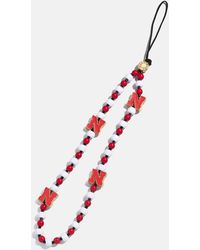 BaubleBar - University Of Nebraska Beaded Phone Charm - Lyst
