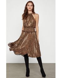 bcbg pleated metallic halter gown