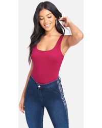 Bebe Synthetic Metal Ring Cross Back Knit Top In Black Lyst