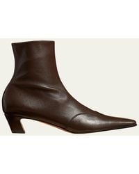 KHAITE - Nevada Stretch Leather Ankle Booties - Lyst