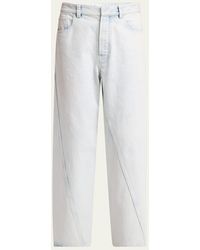 Alaïa - Twisted Seam Mid-Rise Jeans - Lyst