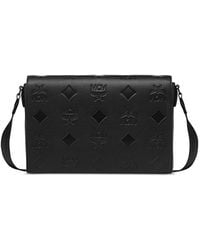 MCM - Klassik Small Maxi Monogram Embossed Leather Messenger Bag - Lyst