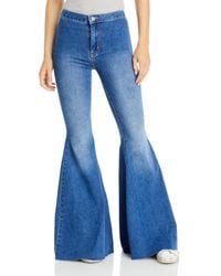 NWT FREE PEOPLE Embellished Float On Flare Jeans Embroidered Blue Size 27 $128