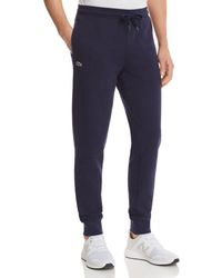 lacoste trackie bottoms
