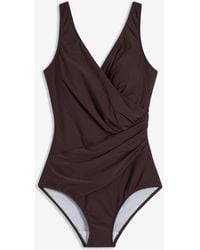 bonprix - Medium Shape-Badeanzug - Lyst