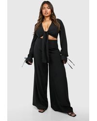 Boohoo - Plus Woven Knot Front Long Sleeve Jumpsuit - Lyst