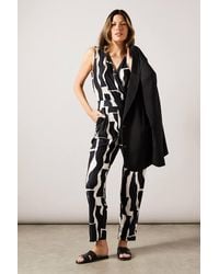 Wallis - Geo Print Jersey Wrap Jumpsuit - Lyst
