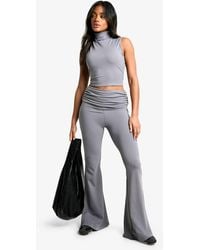 Boohoo - Sculpting Matte Slinky Fold Over Waist Flare Trouser - Lyst