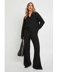 Boohoo - Conjunto Coordinado De Pantalón De Pernera Ancha Y Jersey De Punto En Ochos Suave Con Cuello De Polo - Lyst