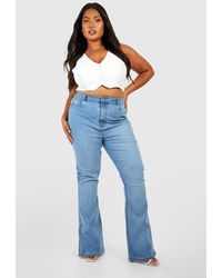 Boohoo - Plus Butt Shaper Split Hem Stretch Flared Jeans - Lyst