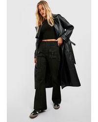 Boohoo - Mid Rise Multi Cargo Pocket Flared Trousers - Lyst