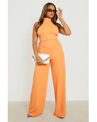 laden hek lening Orange Jumpsuits and rompers for Women | Lyst