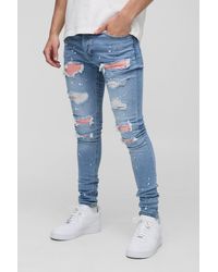 BoohooMAN - Super Skinny Stretch Biker Rip & Repair Paint Splat Jeans - Lyst