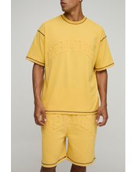 BoohooMAN - Oversized Peached Embossed Contrast Stitch T-Shirt & Dropped Crotch Shorts Set - Lyst