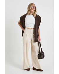 Boohoo - Petite Woven Pleated Wide Leg Trouser - Lyst
