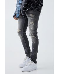 BoohooMAN - Skinny Stretch Bleached Ripped Knee Jeans - Lyst
