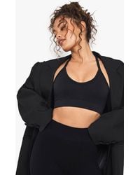 Boohoo - Seamless Rib Plunge Cross Back Sports Bra - Lyst