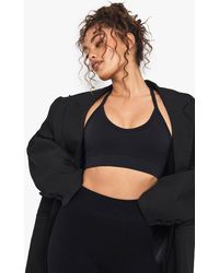 Boohoo - Seamless Rib Plunge Cross Back Sports Bra - Lyst