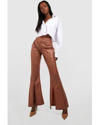 Boohoo - Split Front Leather Look Flared Trousers - Lyst