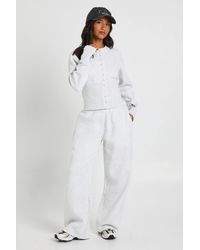 Boohoo - Petite Deep Hem Popper Bomber Sweatshirt Tracksuit - Lyst
