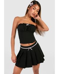 Boohoo - Pleated Bow Detail Micro Mini Skirt - Lyst