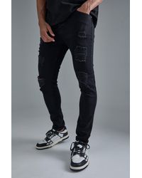 BoohooMAN - Skinny Stretch All Over Rip Jeans - Lyst