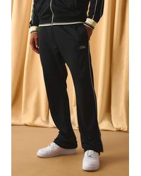 Boohoo - Slim Stacked Flare Embroidered Stripe Tricot Track Pants - Lyst