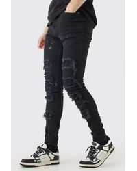 Boohoo - Tall Super Skinny Pu Biker Rip & Repair Paint Splatter Jeans - Lyst