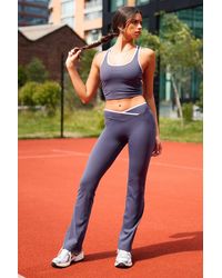 DSGN Studio - Ultra Sculpt Contrast Binding Wrap Waist Flare Legging - Lyst