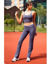 DSGN Studio - Ultra Sculpt Contrast Binding Wrap Waist Flare Legging - Lyst