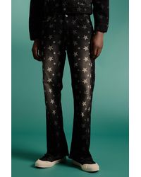 BoohooMAN - Relaxed Rigid Flare All Over Star Print Jeans - Lyst