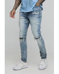 BoohooMAN - Tall Acid Wash Rip & Repair Stacked Skinny Jeans - Lyst