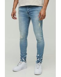 Boohoo - Vaqueros Pitillo Elásticos Rotos Con Salpicadura De Pintura En El Bajo - Lyst