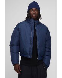 BoohooMAN - Oversized Boxy Piping Panel Funnel Neck Puffer Jacket - Lyst