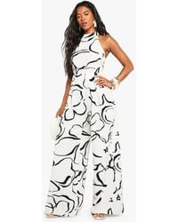 Boohoo - Abstract Floral Linen Look Halterneck Backless Jumpsuit - Lyst
