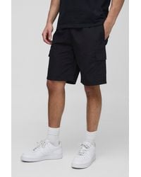 BoohooMAN - Elasticated Waist Relaxed Mid Length Crinkle Nylon Cargo Shorts - Lyst