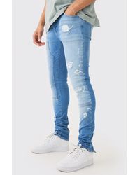 BoohooMAN - Skinny Stretch Stacked Ripped Carpenter Zip Hem Jeans In Light Blue - Lyst