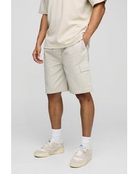 BoohooMAN - Lockere mittellange Canvas Cargo-Shorts mit elastischem Bund - Lyst